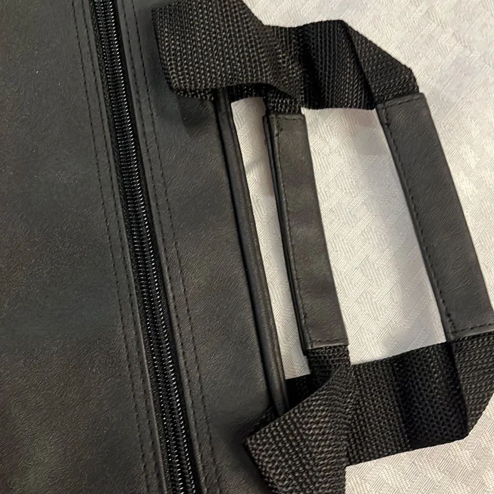 Briefcase, Black, Handles and Shoulder Straps lots of storage.